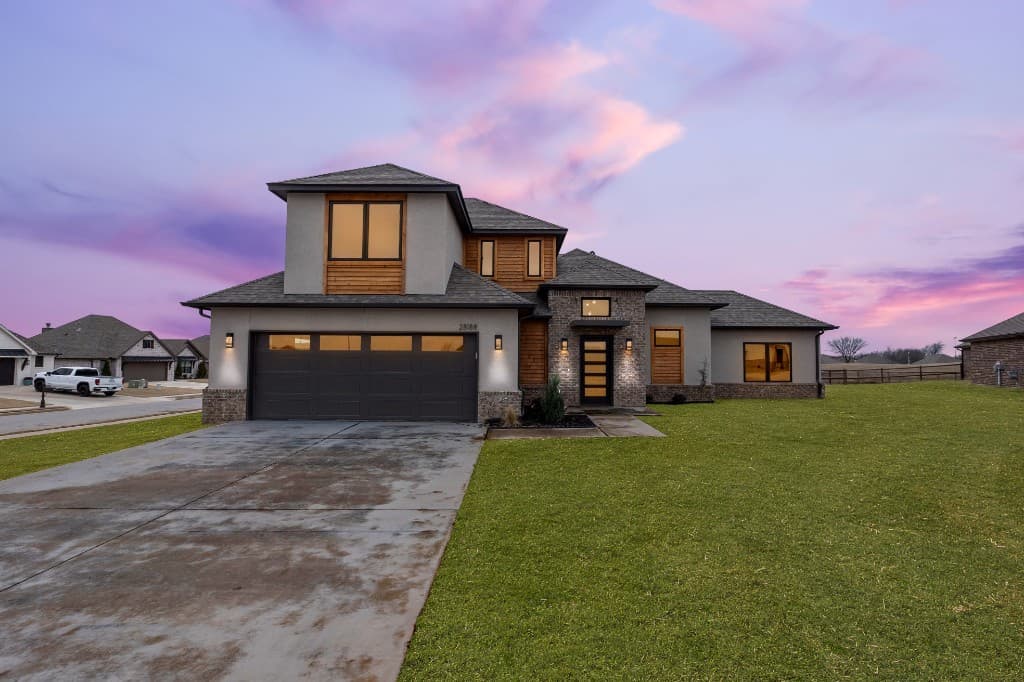 Modern home with new roof at dusk