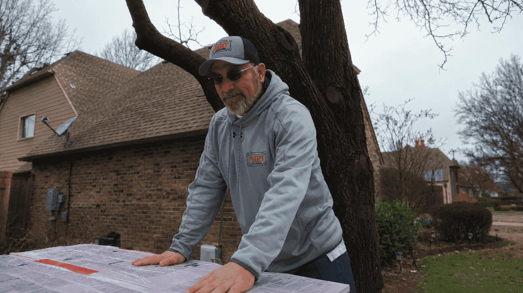 Roofing professional working with tools on site