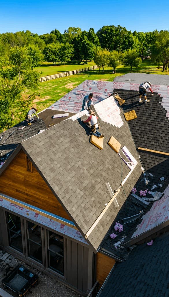 Aerial view of ARRT roofing crew installing shingles