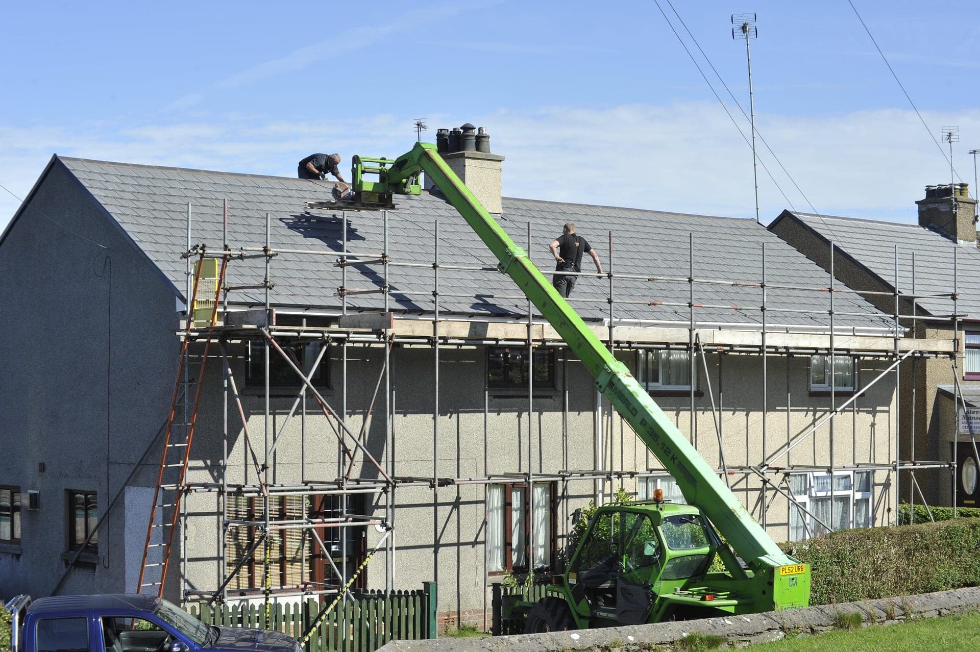 Scaffolding and equipment set up for a full roof replacement