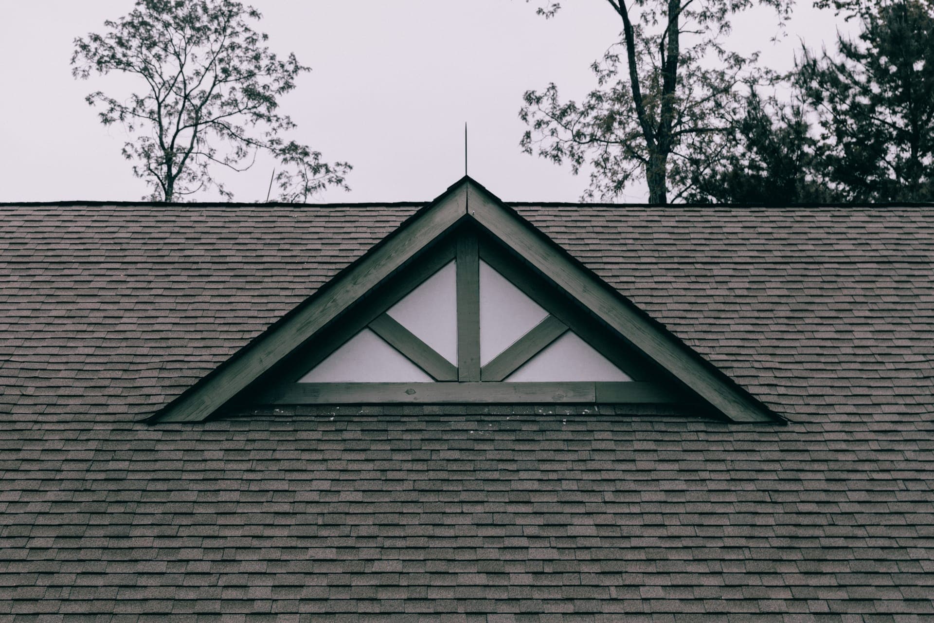 Decorative gable detail on a shingled residential roof